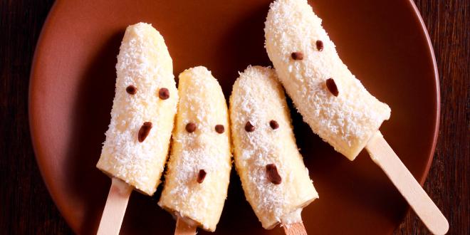 banana popsicles with coconut decorated for Halloween