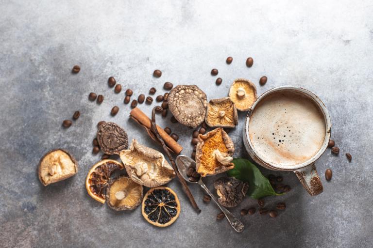 dried mushrooms, coffee beans, and a steaming cup